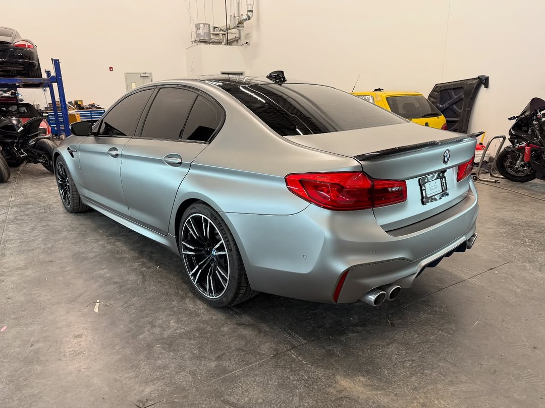BMW M5 F90 in full stealth paint protection film with Xpel 10mil PPF on the carbon roof and Fusion satin ceramic coating